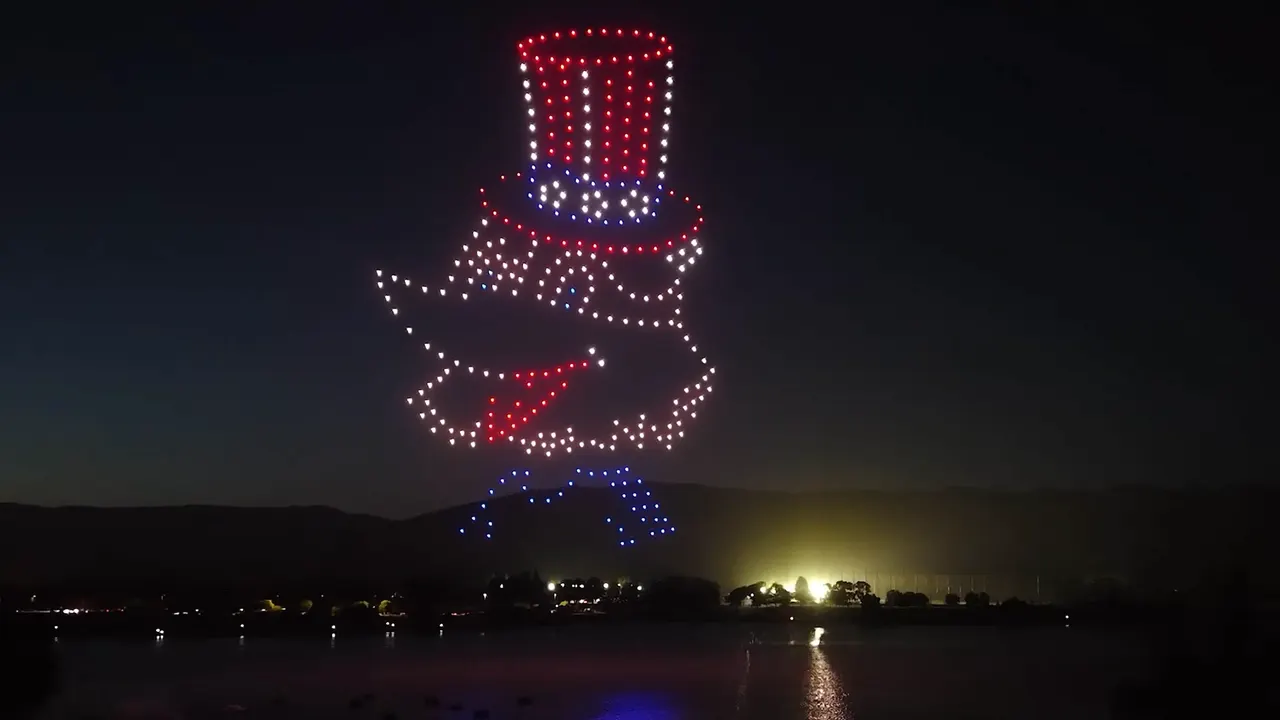 Uncle Sam in red, white and blue drones over the lake in Fremont