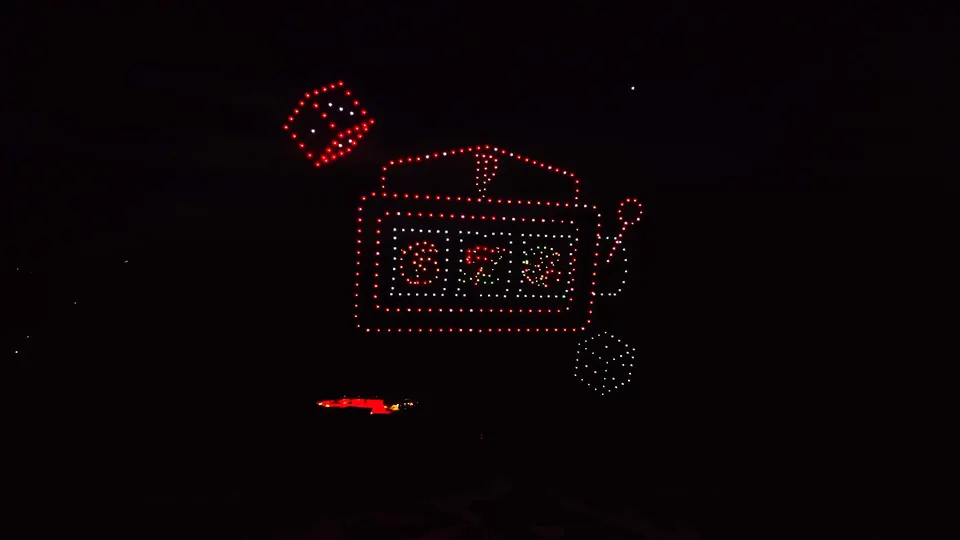 A slot machine and dice formed by drones