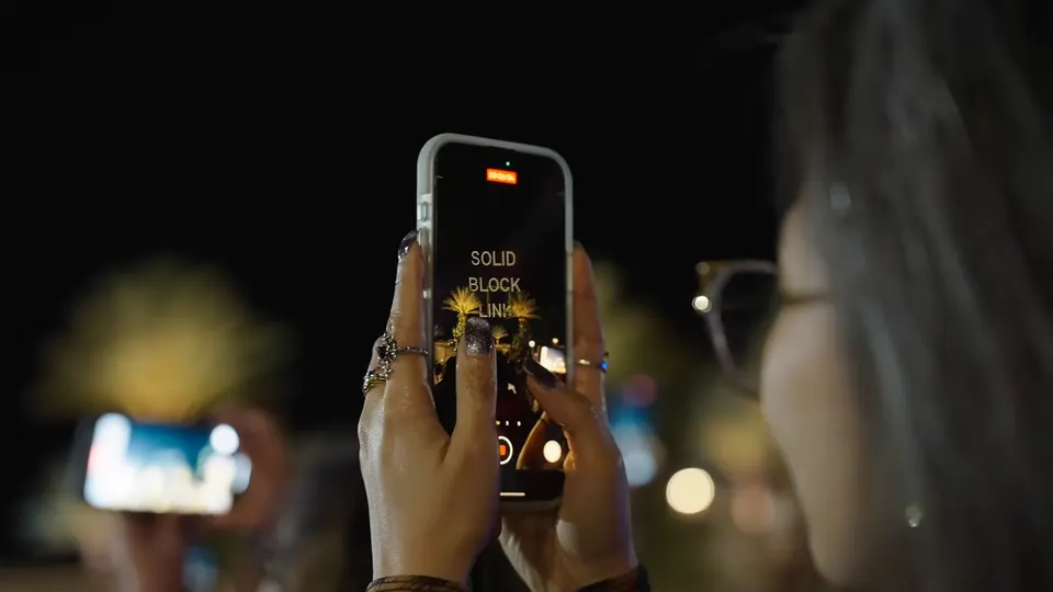 A fan filming the SB19 drone show on her phone
