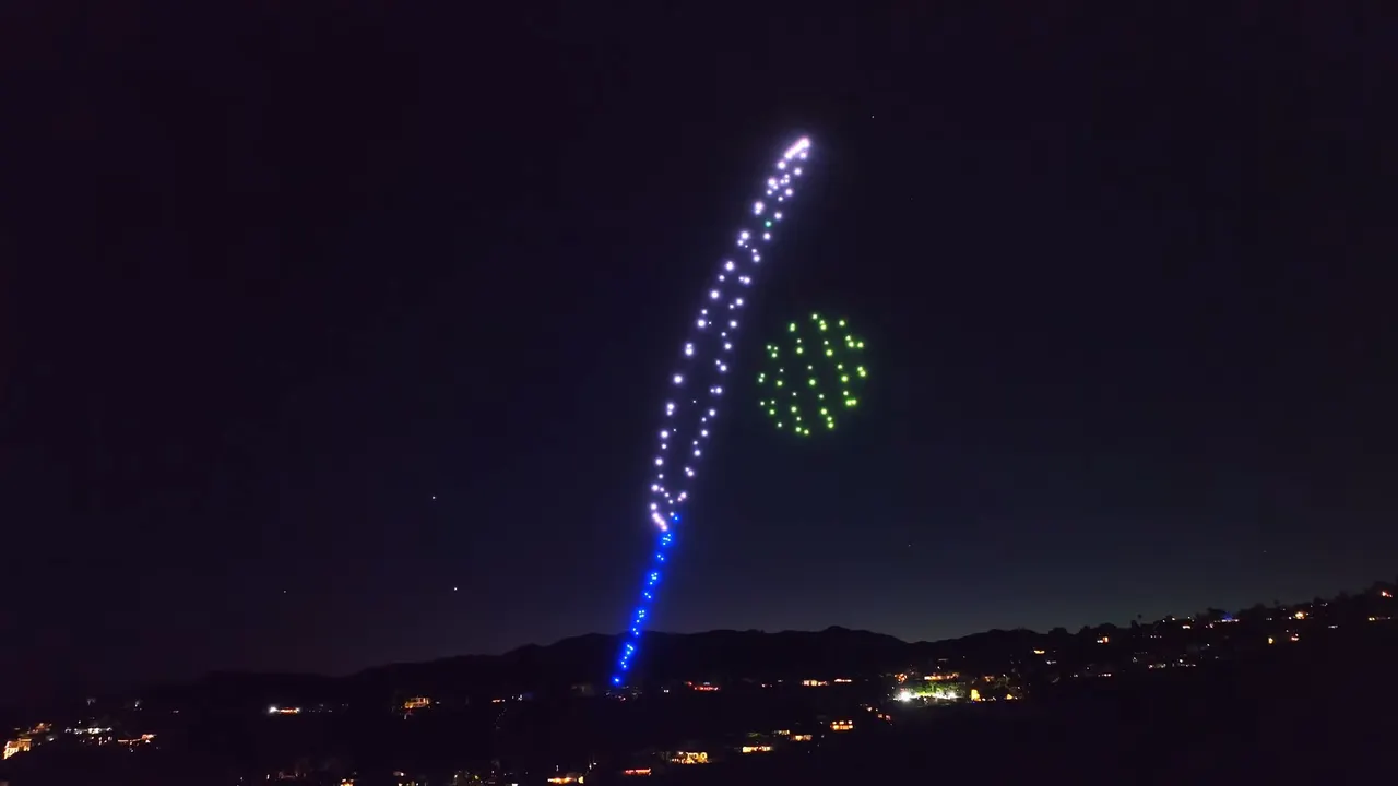 A drone quill writing in the sky above Los Angeles
